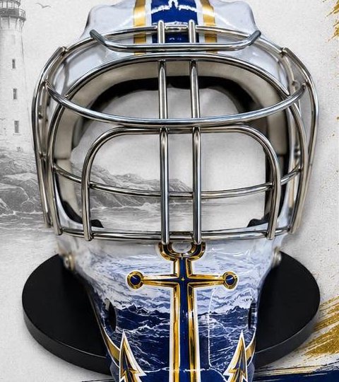 Front of a white and navy RI Junior Blues goalie mask with an anchor design