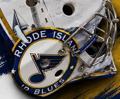Side of the RI Junior Blues mask showing a lighthouse and team crest